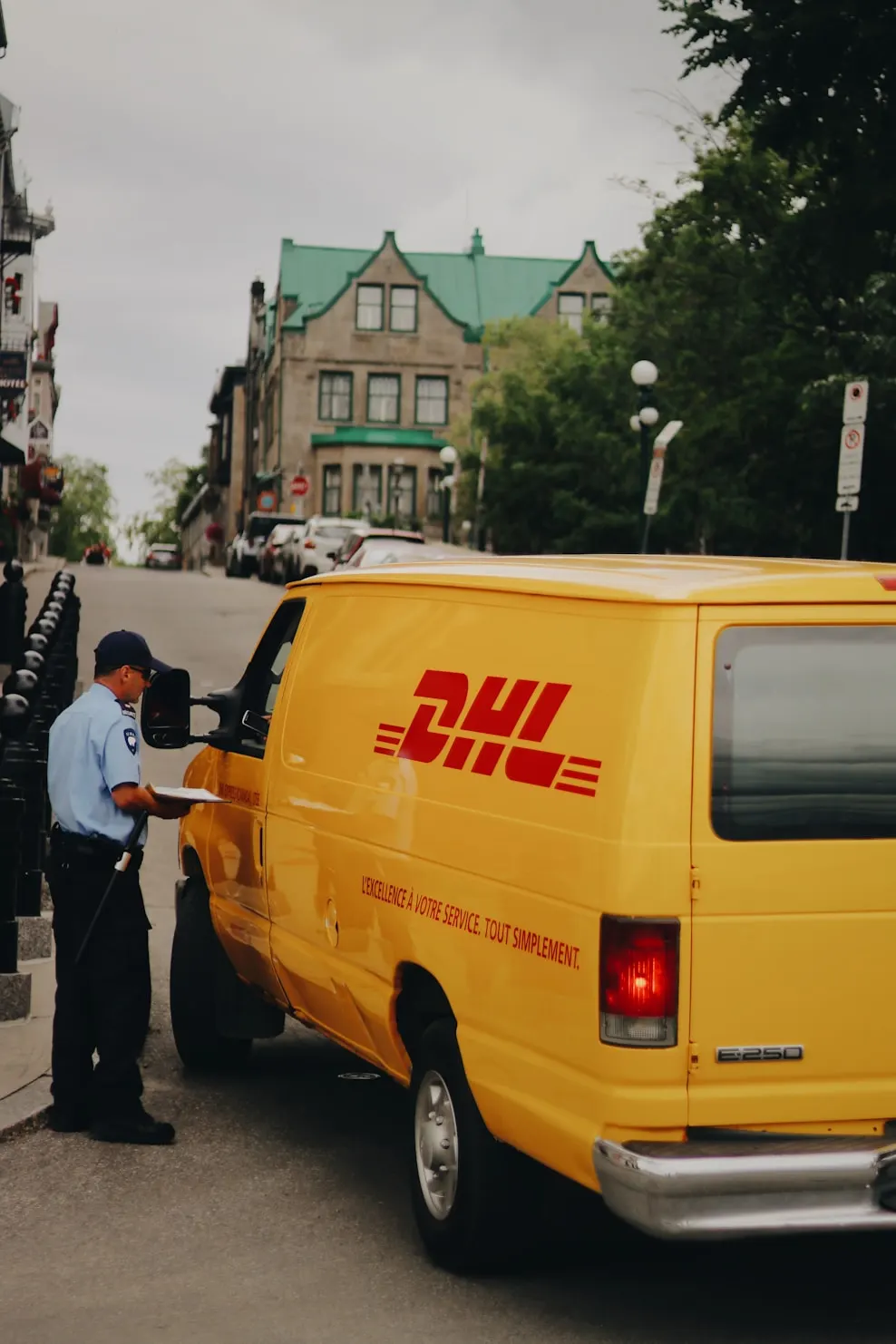 A sealed camera box being handed over